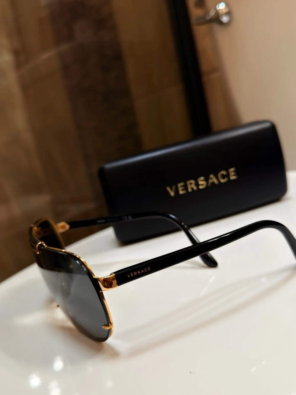 Versace MENS WOMENS Unisex Gold and Black Shield Sunglasses VE2140